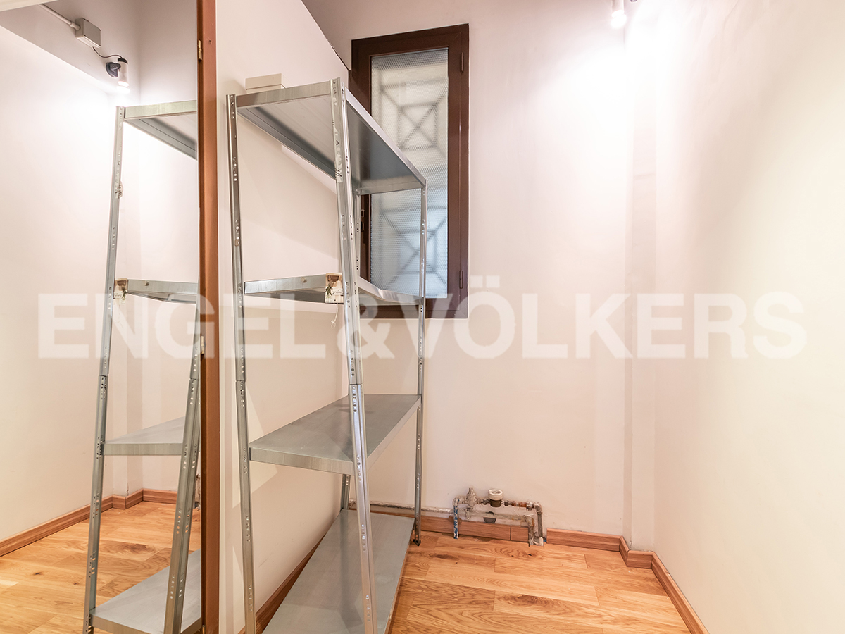 Shop with display windows on Quintino Sella Street