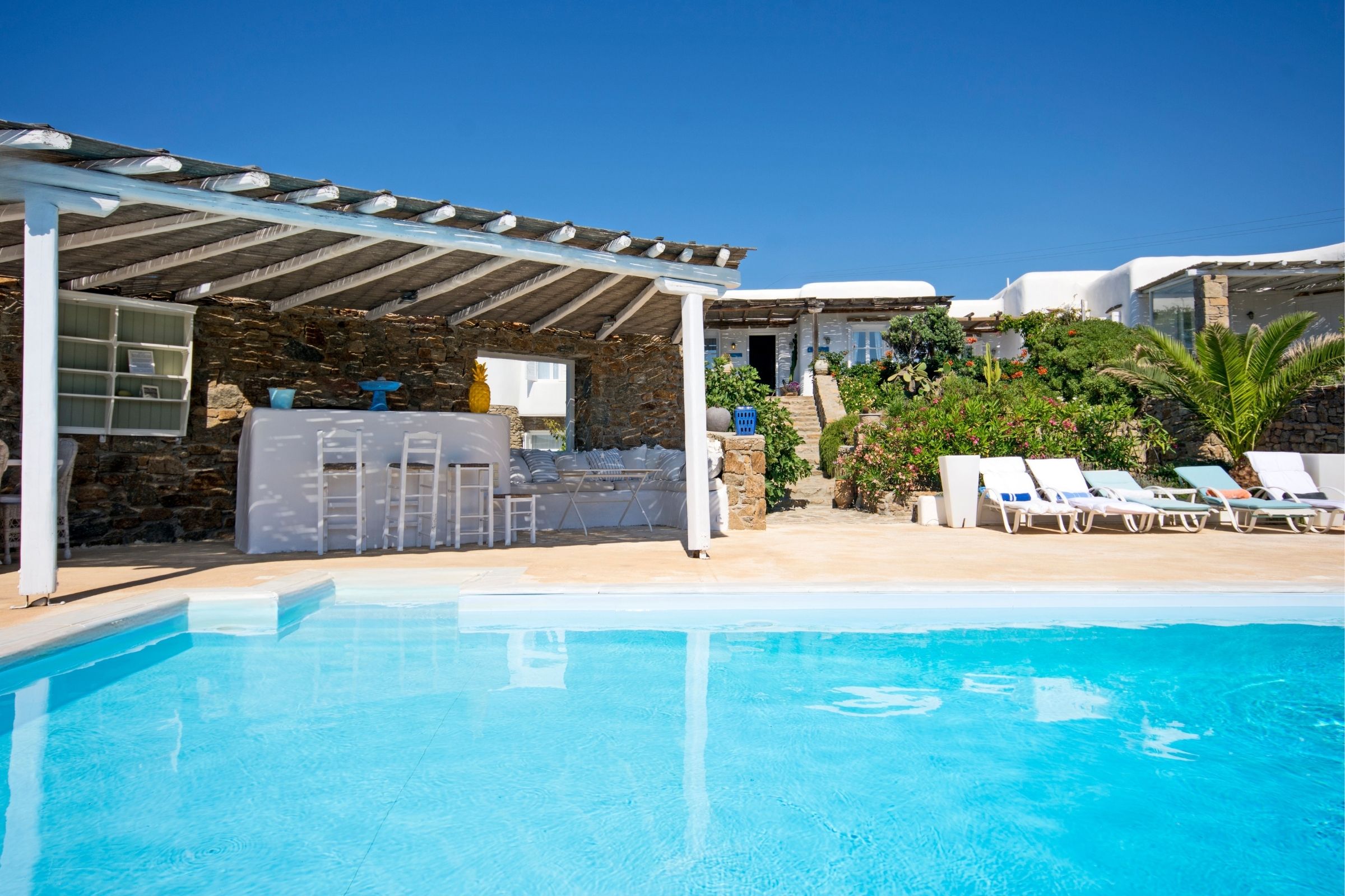 Cycladic villa with iconic lighthouse views & private guesthouses in Mykonos