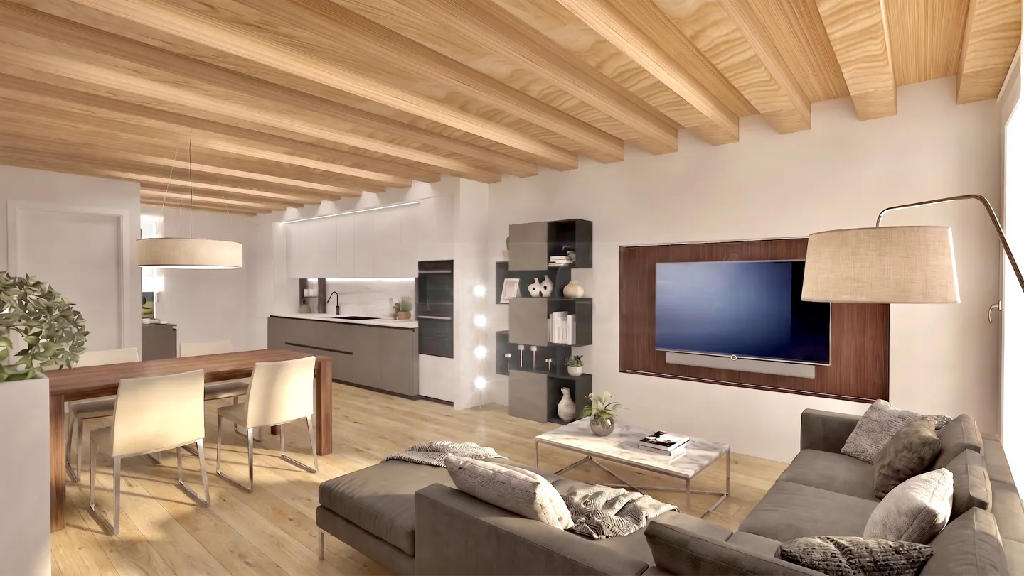 Open-concept living space with wood-beamed ceiling, gray sofa, dining table, and modern kitchen. A TV is mounted on the wall.