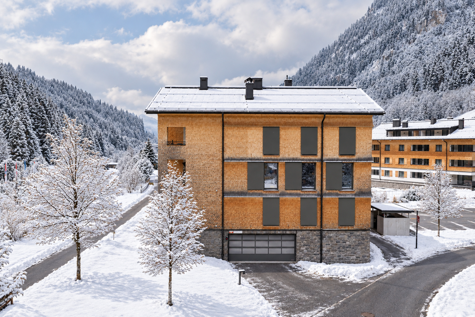 Modern wooden apartment building with stone base and snow-covered roof in a snowy mountain landscape with pine trees. [AI-generated text] [Modificato da IA]