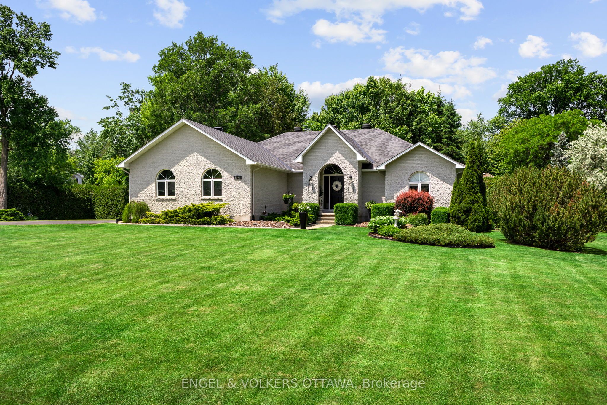 Enjoy Luxurious Living on a Peaceful, Treed Corner Lot