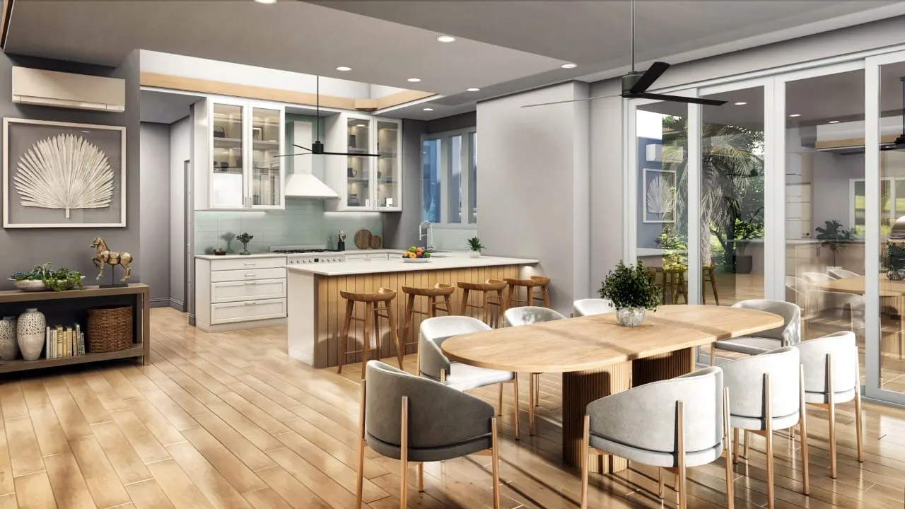 A modern, open-concept kitchen and dining area with light wood floors. White cabinets and a wood island complement the dining table with gray chairs. Sliding glass doors lead to an outdoor view.