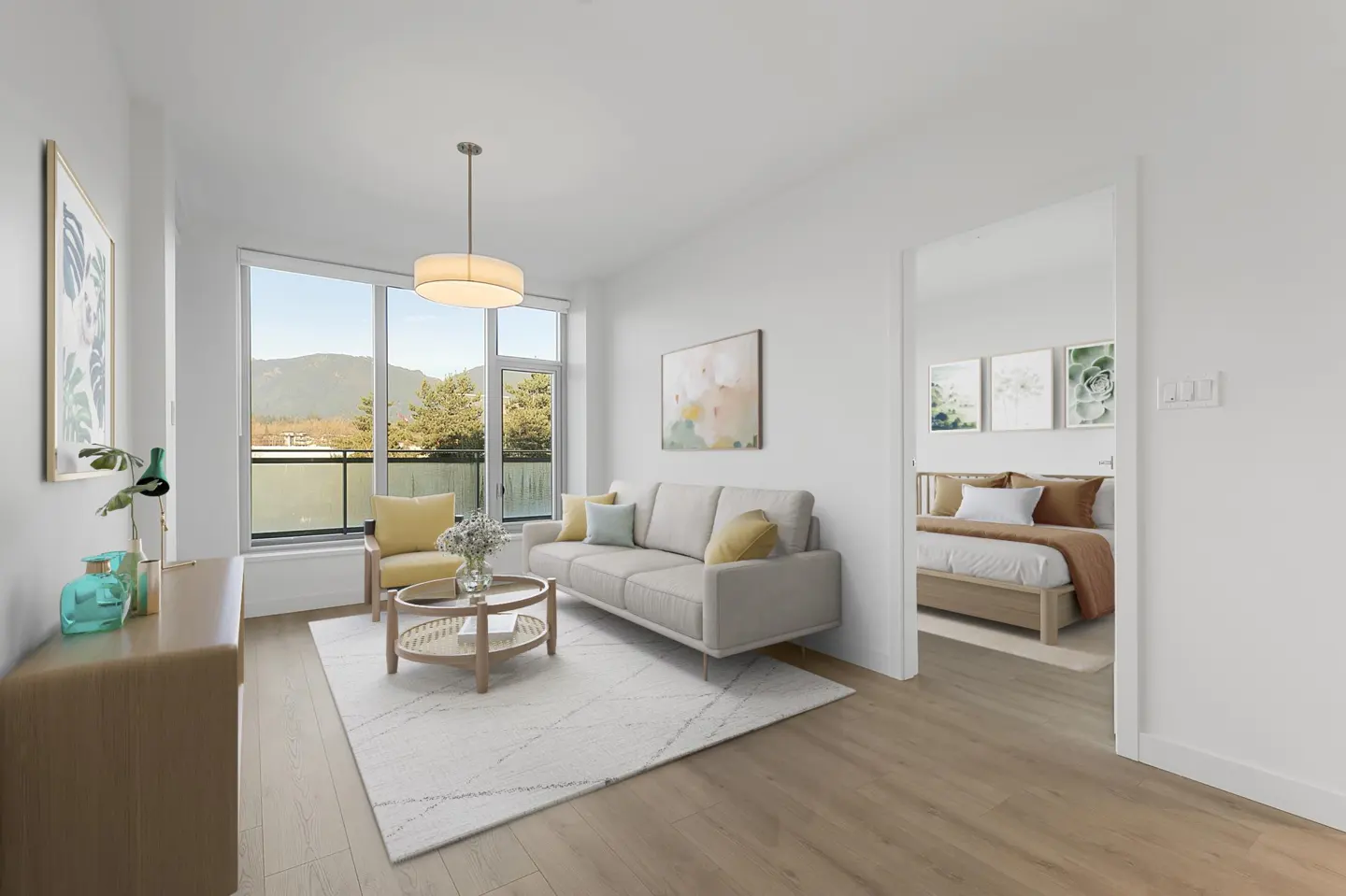 Bright living room with a beige sofa, yellow chair, and round coffee table on a white rug. A bedroom is visible through a doorway.