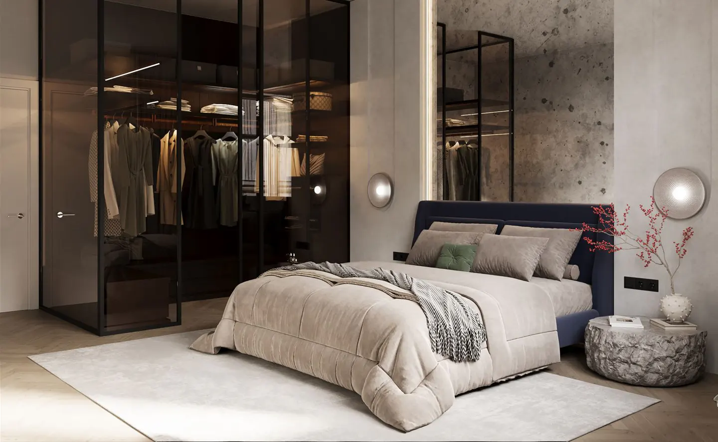 Bedroom with a blue bed, beige comforter, and a glass-enclosed closet filled with clothes. A stone-like side table holds books and a vase with red flowers.