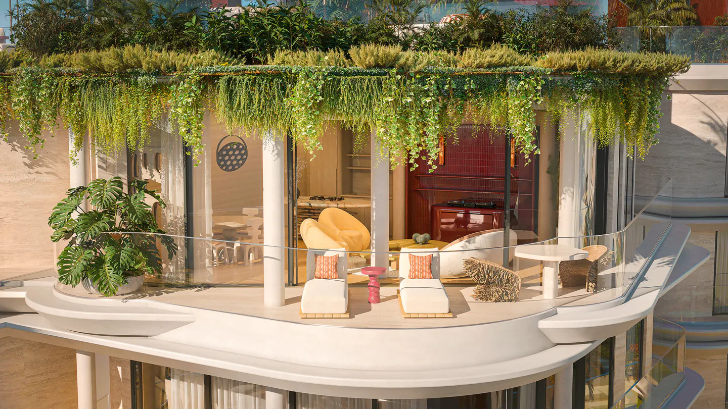 A luxurious balcony with lounge chairs, a table, and lush greenery. The interior features modern furniture and a red accent wall.