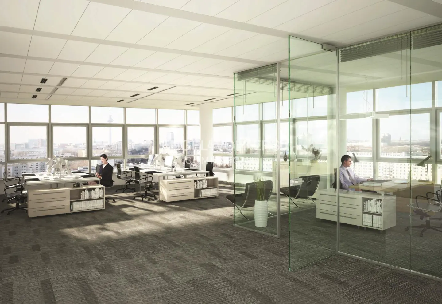 Bright, modern office space with large windows, desks, and glass-walled offices. Two people are working at their desks.