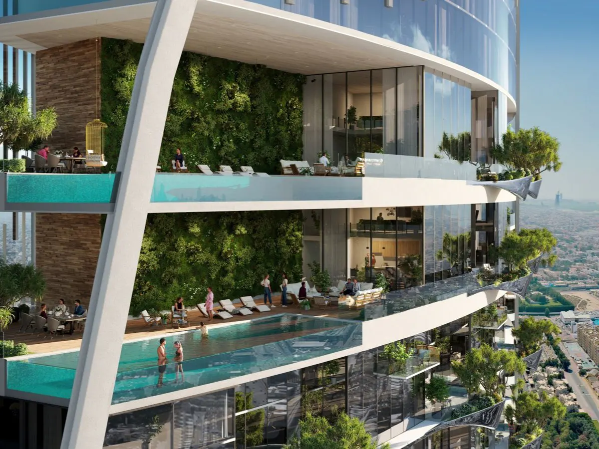 Exterior view of a modern high-rise building with pools, green walls, and people relaxing on balconies.