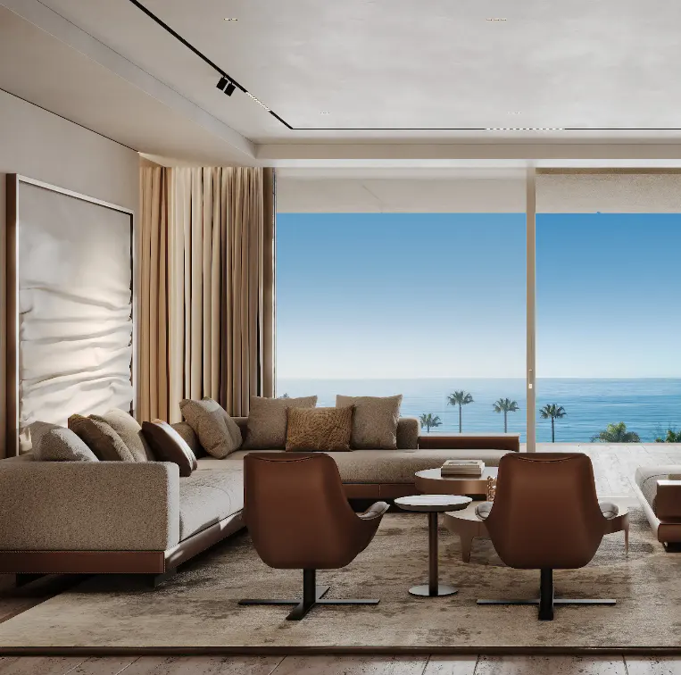 Living room with a beige sofa, brown chairs, and a view of the ocean through large windows.