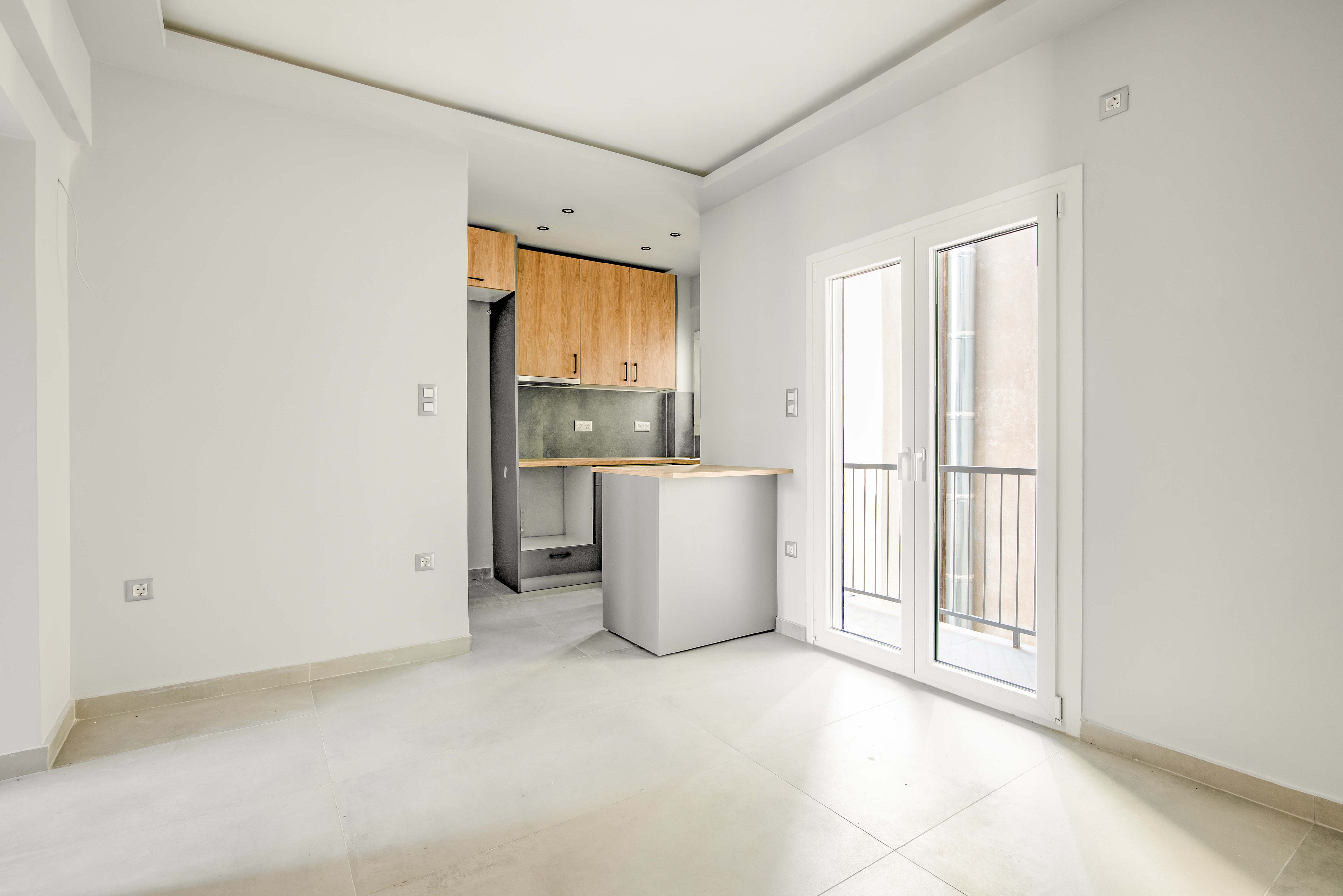 Fully renovated top floor apartment with open views near Omonia