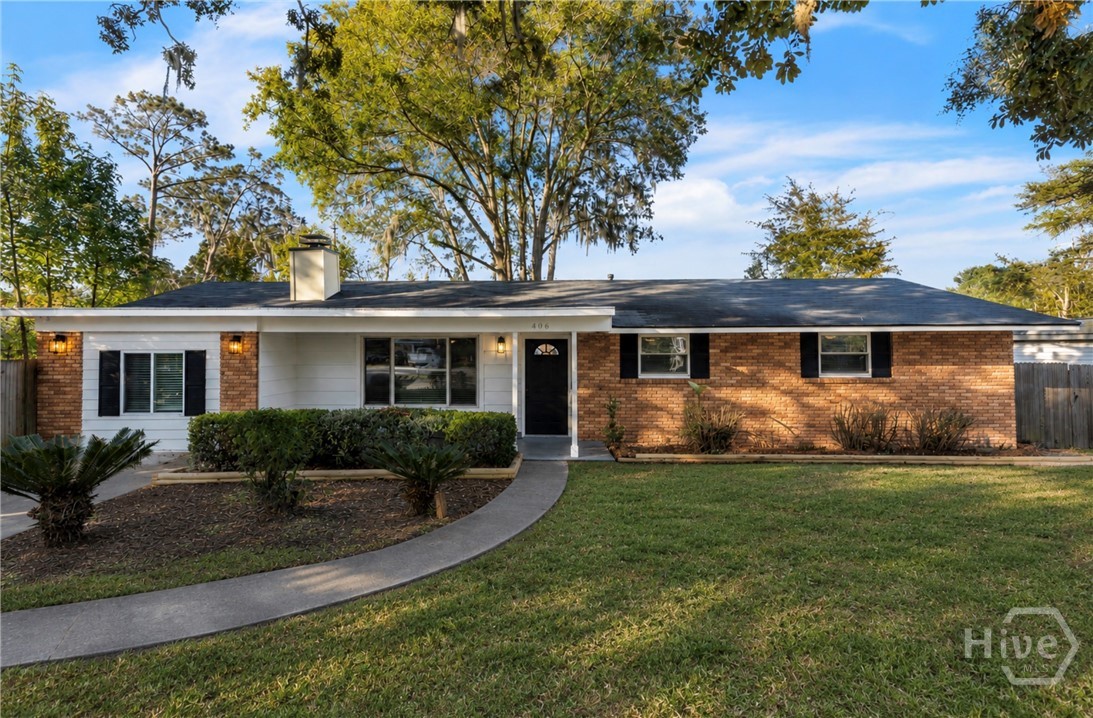 Hardwood Floors, Sunroom & a Backyard Made for Entertaining