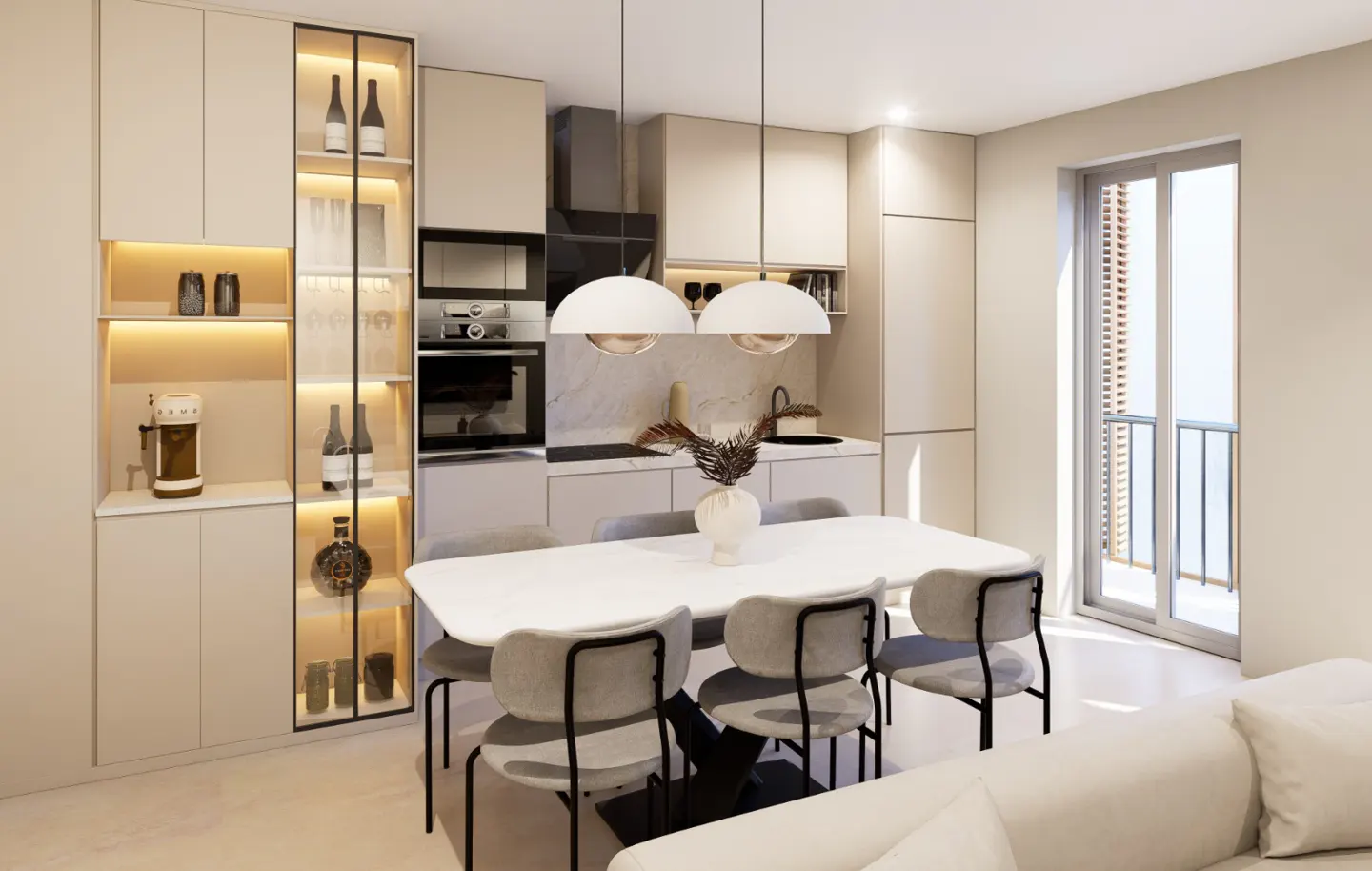 A modern kitchen and dining area with beige cabinets, a white table, and gray chairs. Two pendant lights hang above the table. A sliding glass door leads to a balcony.