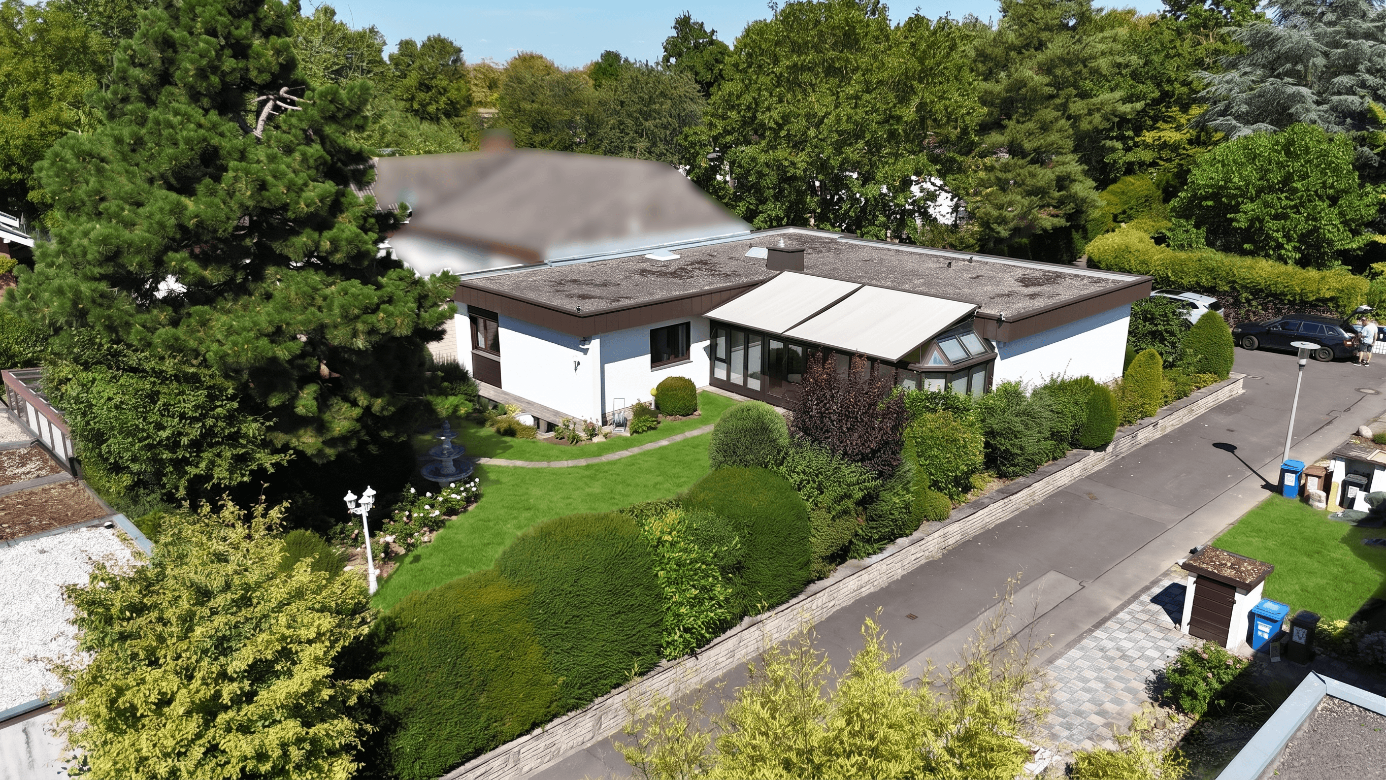 Vom Wohnzimmer direkt ins Grüne – Charmanter Bungalow mit Wintergarten