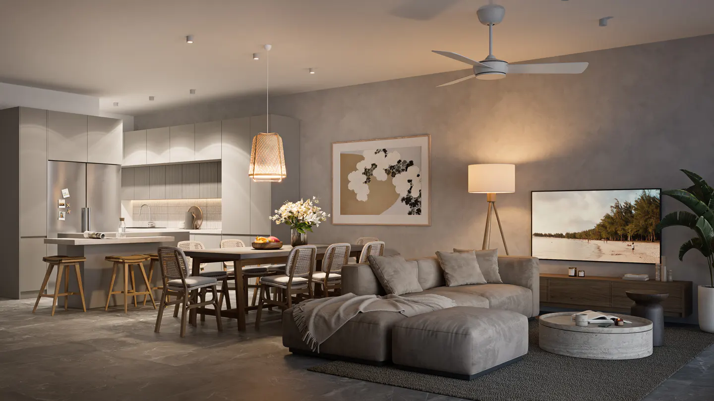 A modern living space with a gray sofa, dining table, kitchen island, and TV. A ceiling fan and floor lamp provide light.
