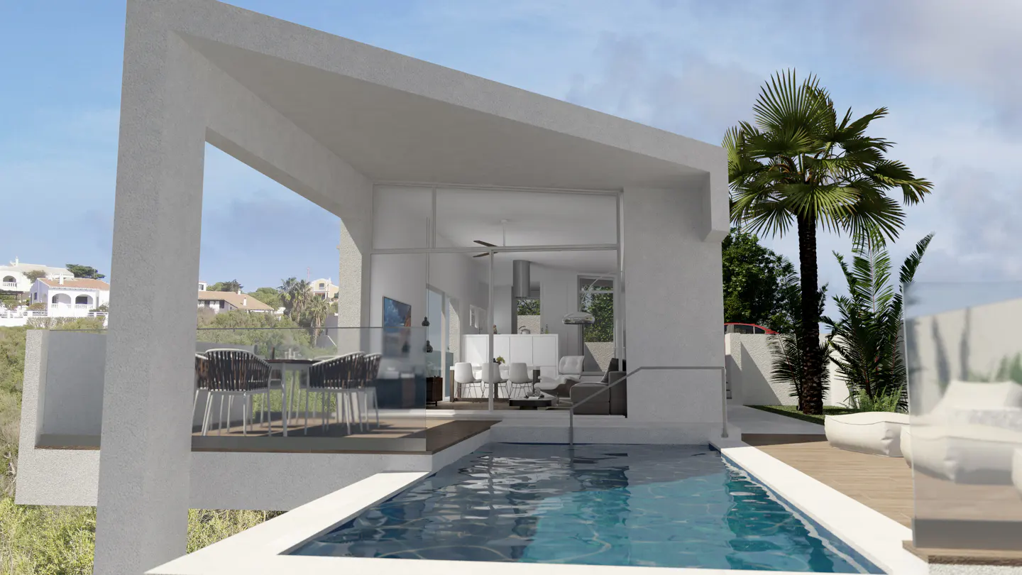 Modern white villa with a pool. Glass doors open to a living area. Outdoor seating area with table and chairs. Palm trees in the background.