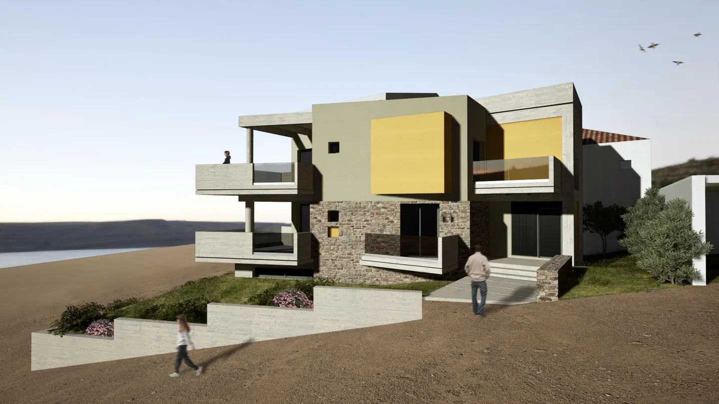 Modern multi-story home with stone and yellow accents, balconies, and people walking on a sloped landscape near the water.