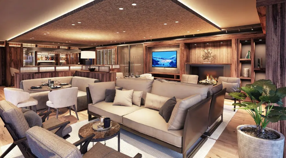 A warm, wood-paneled lounge area with sofas, chairs, a fireplace, and a bar in the background.