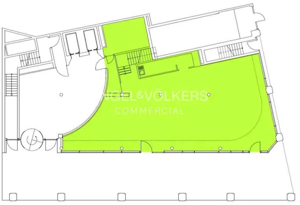 Floor plan of a commercial space with green highlighted area, stairs, and the Engel & Völkers logo.