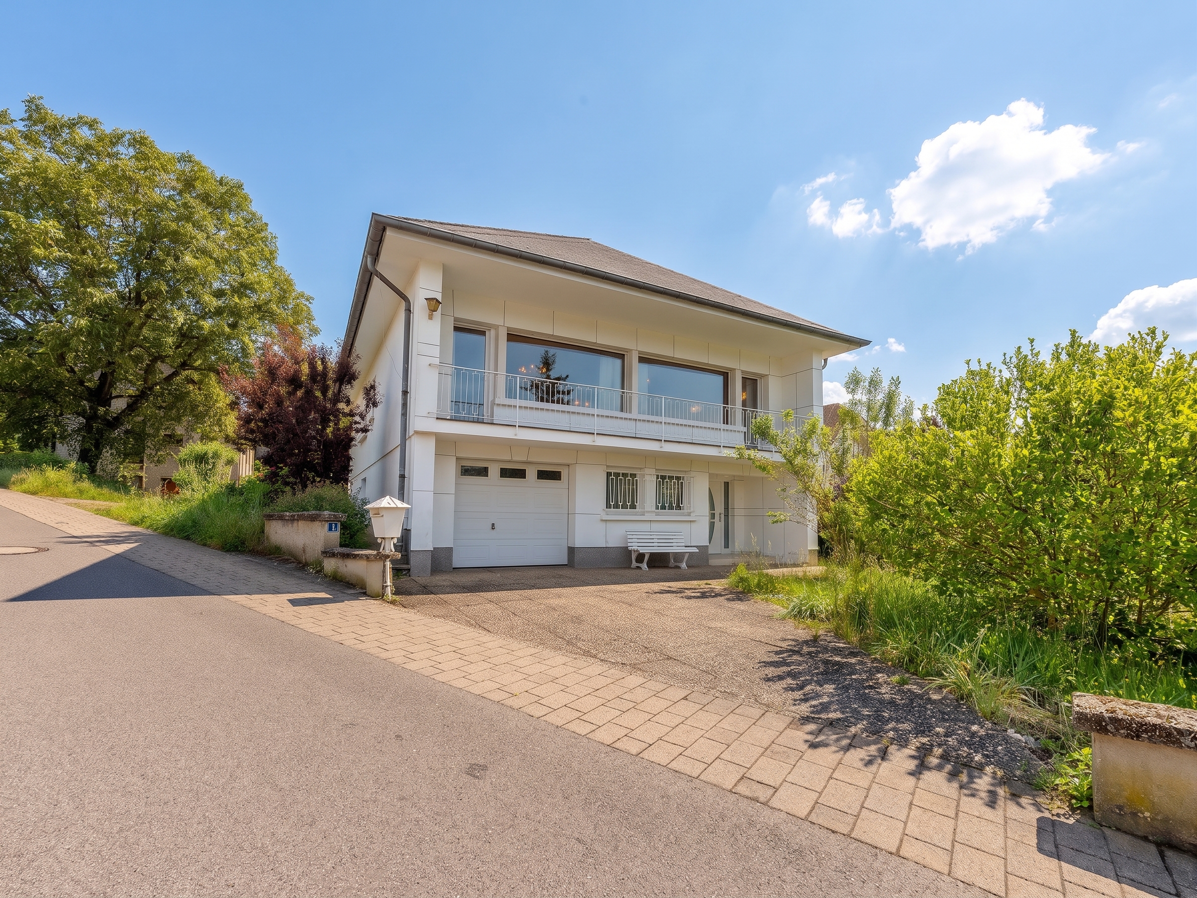 Detached 4-sided single-family home with development potential