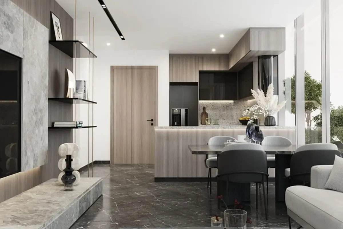 A modern open-concept living space with a kitchen, dining area, and lounge, featuring gray marble floors and neutral tones.