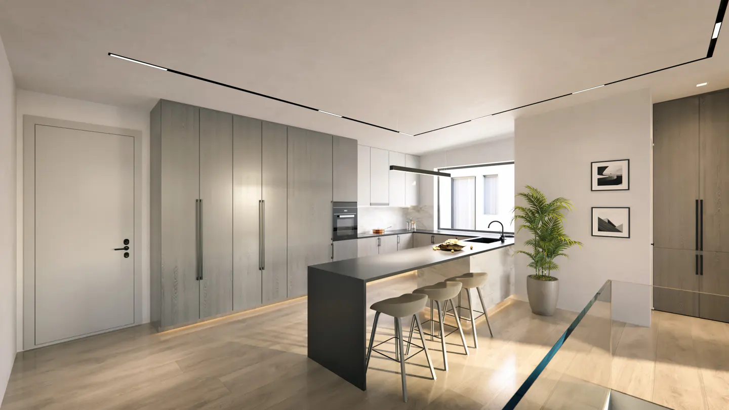 Modern kitchen with gray cabinets, a black island with stools, and track lighting. A potted plant and framed art add a touch of elegance.