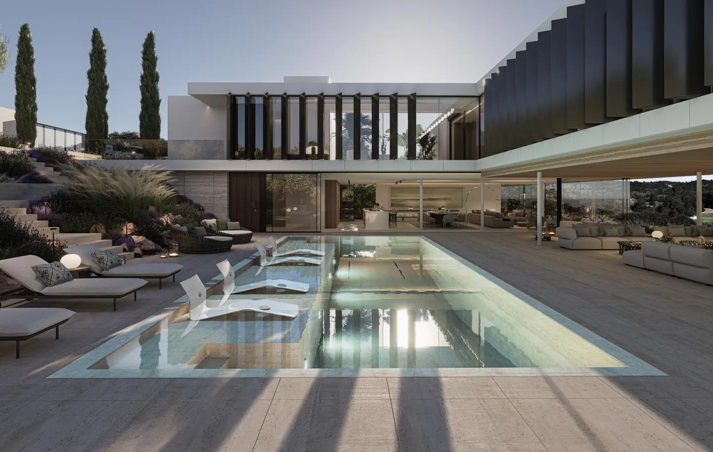 Modern home exterior with a pool. Lounge chairs sit poolside. Large windows and doors open to the interior living spaces.
