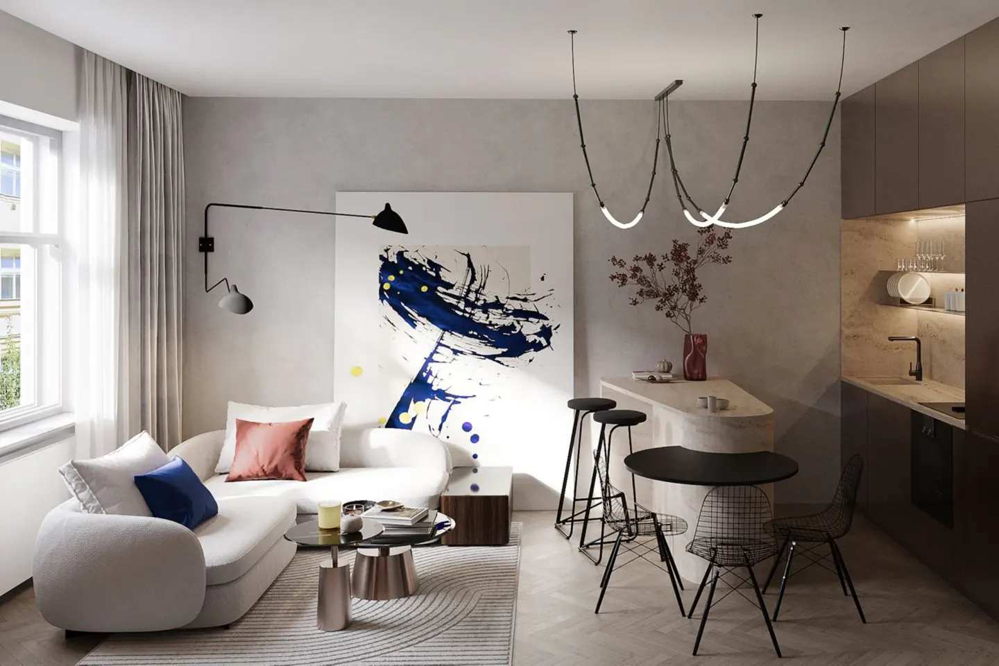 A modern apartment interior with a white sofa, abstract art, and a kitchen area with bar stools and a black table.
