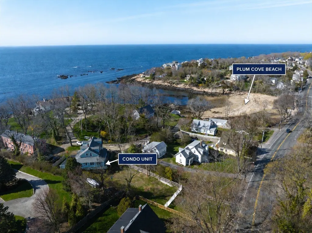 Aerial view of a condo unit near Plum Cove Beach, with blue ocean in the background.