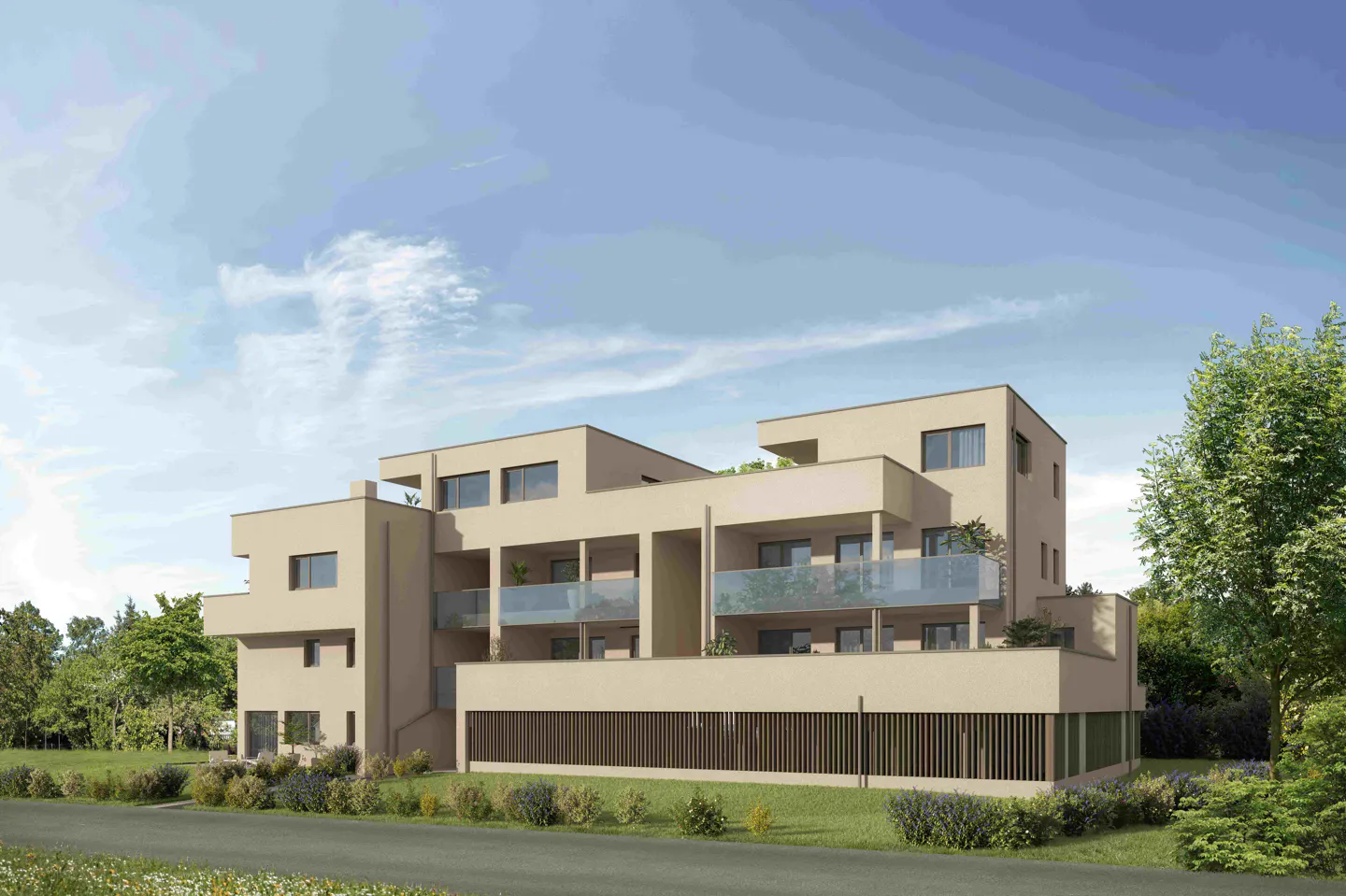 Modern beige apartment building with glass balconies, surrounded by green trees and grass under a blue sky.