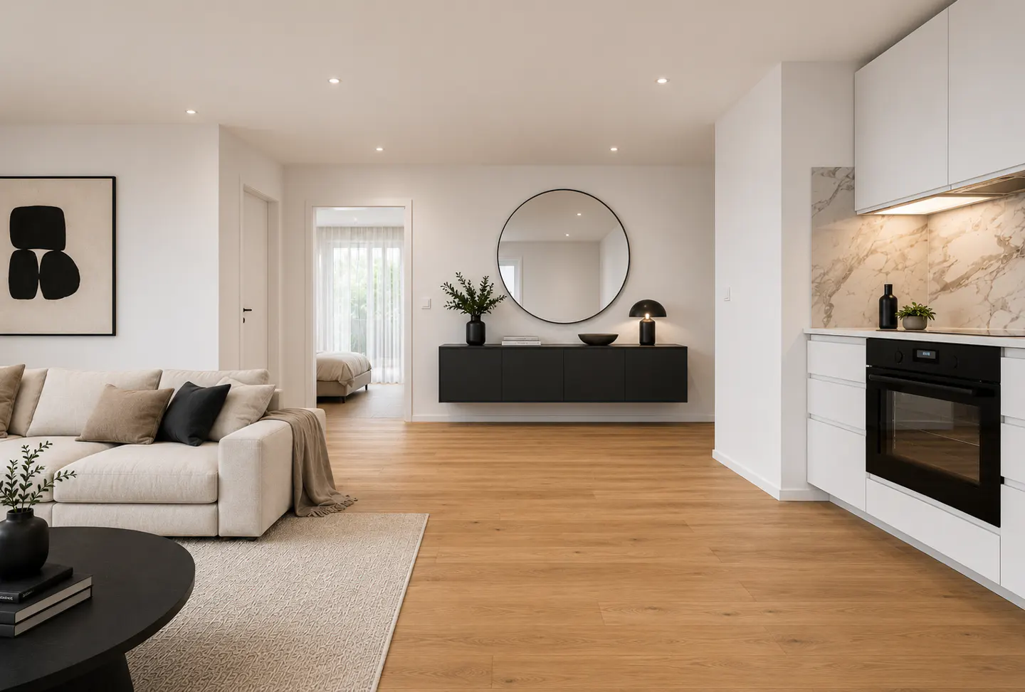 Modern open-plan living area with light wood floors, white sofa, black floating console, and sleek white kitchen.