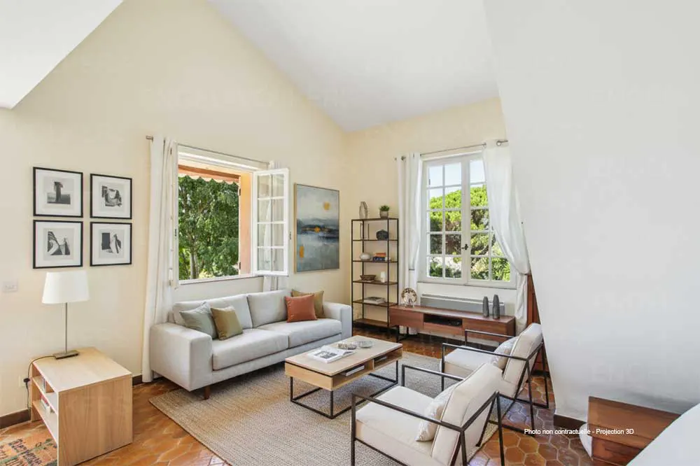 Living room with a gray sofa, two chairs, a coffee table, and two windows with white curtains.