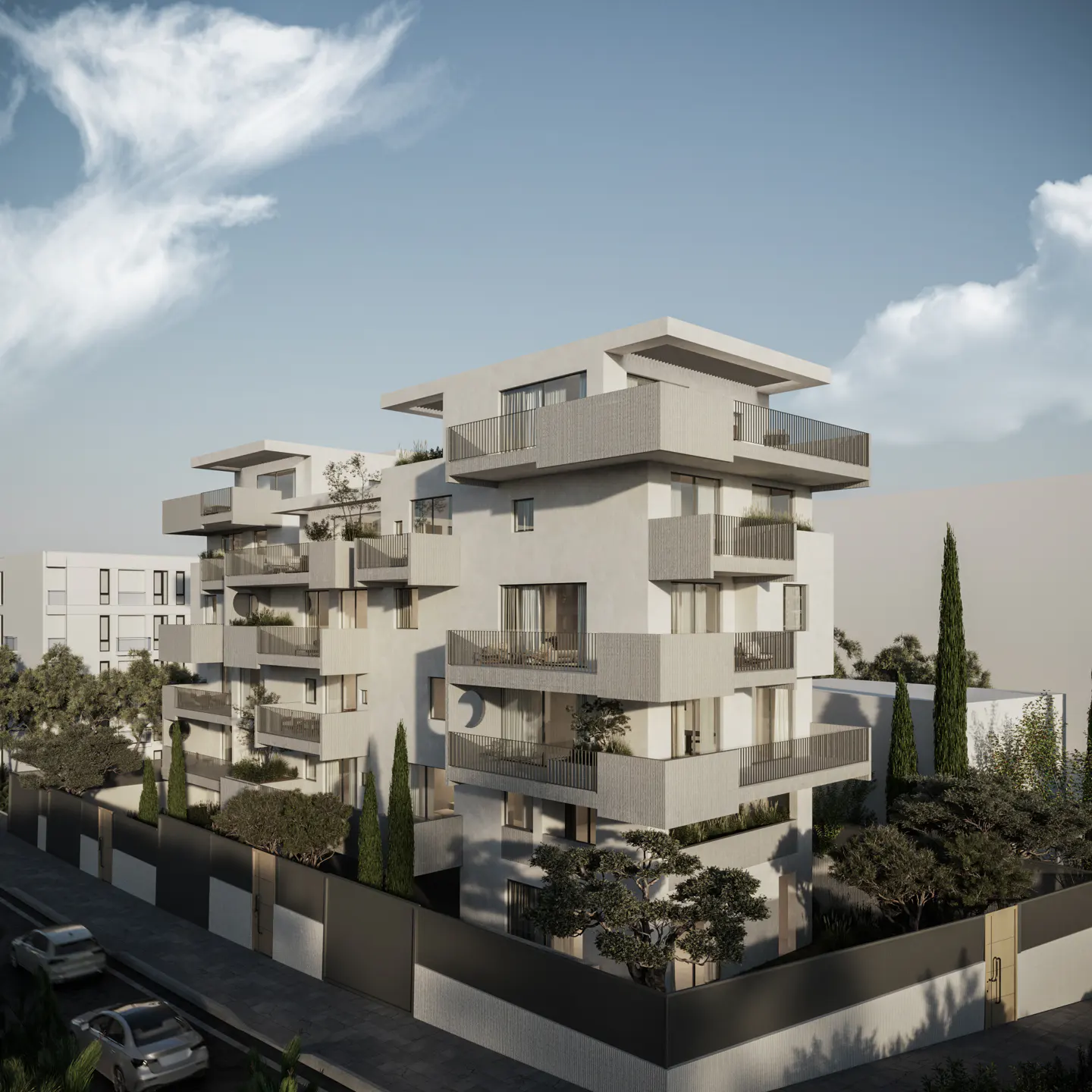 Modern, multi-story apartment building with gray balconies and white facade under a blue sky with clouds. Trees and cars are visible.