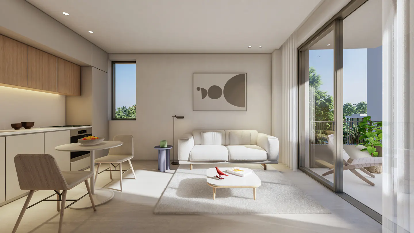 Bright, modern apartment interior with a white sofa, kitchen, and balcony view. A round table and chairs sit near the kitchen area.