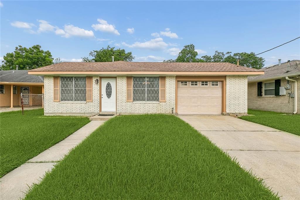 Move-In Ready with Workshop & Rear Yard Access!