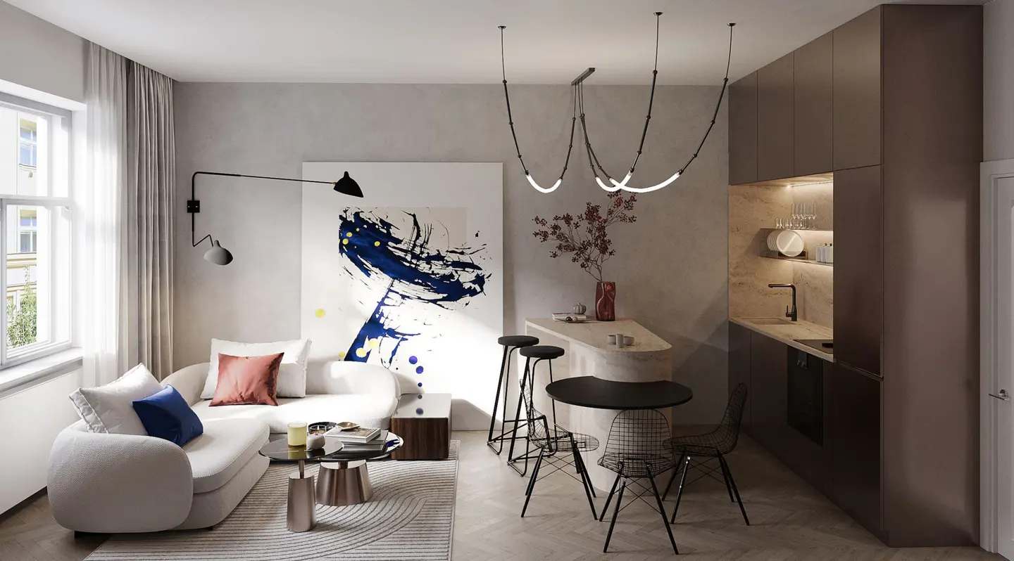 A modern apartment interior with a white sofa, abstract art, a kitchen area, and unique lighting fixtures.