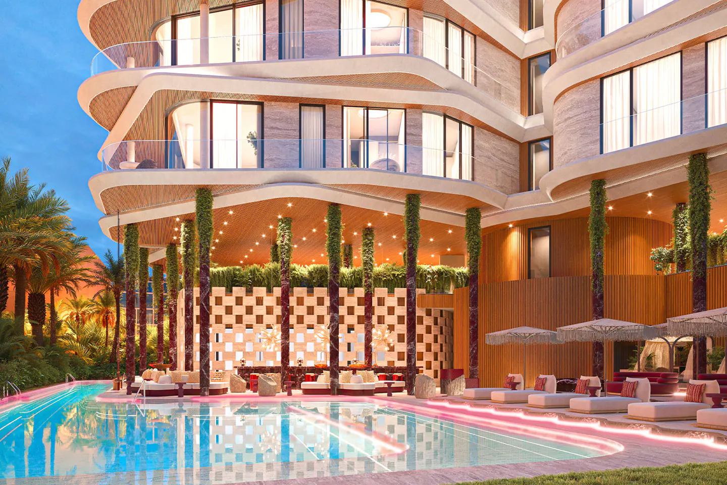 Luxury resort exterior with a pool. Lounge chairs line the pool's edge. The building has curved balconies and is supported by vine-covered columns.