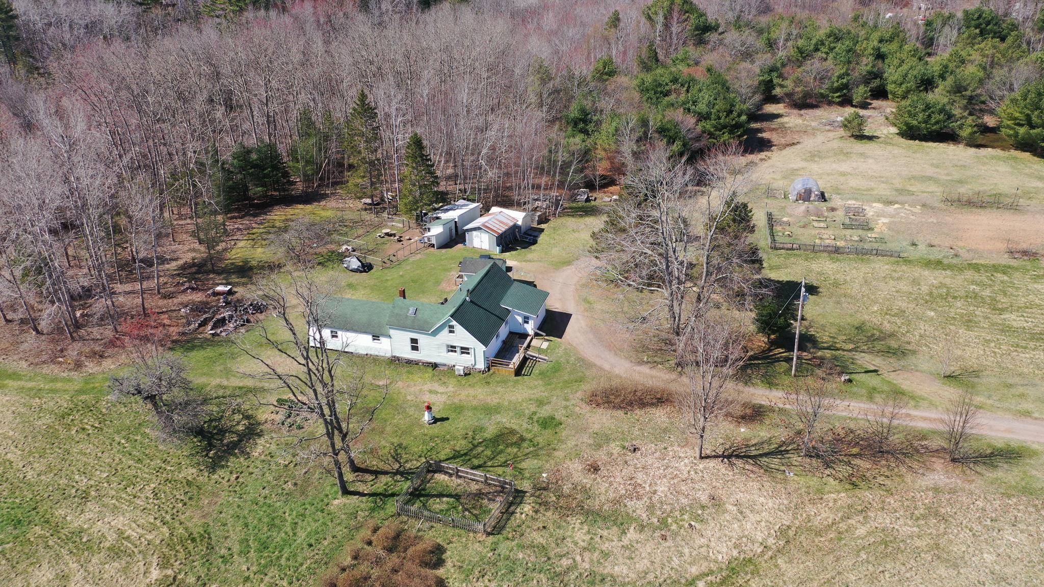 Historic 28-Acre Riverfront Hobby Farm with Organic Gardens
