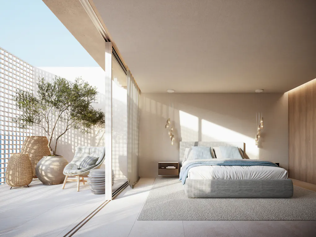 A bright bedroom with a gray bed, blue accents, and a sunny patio with plants.