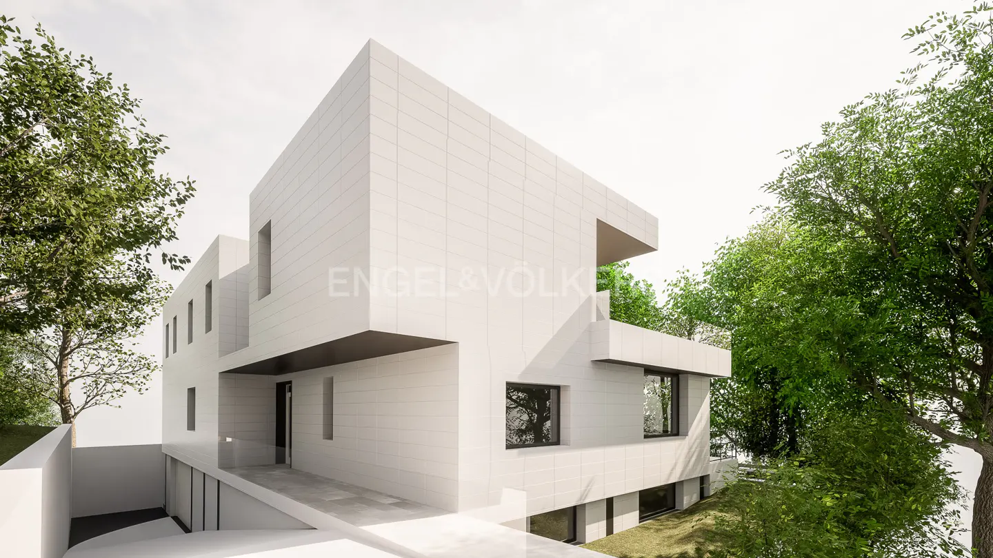 Modern white cube-shaped house with flat roof, black framed windows, and green trees.