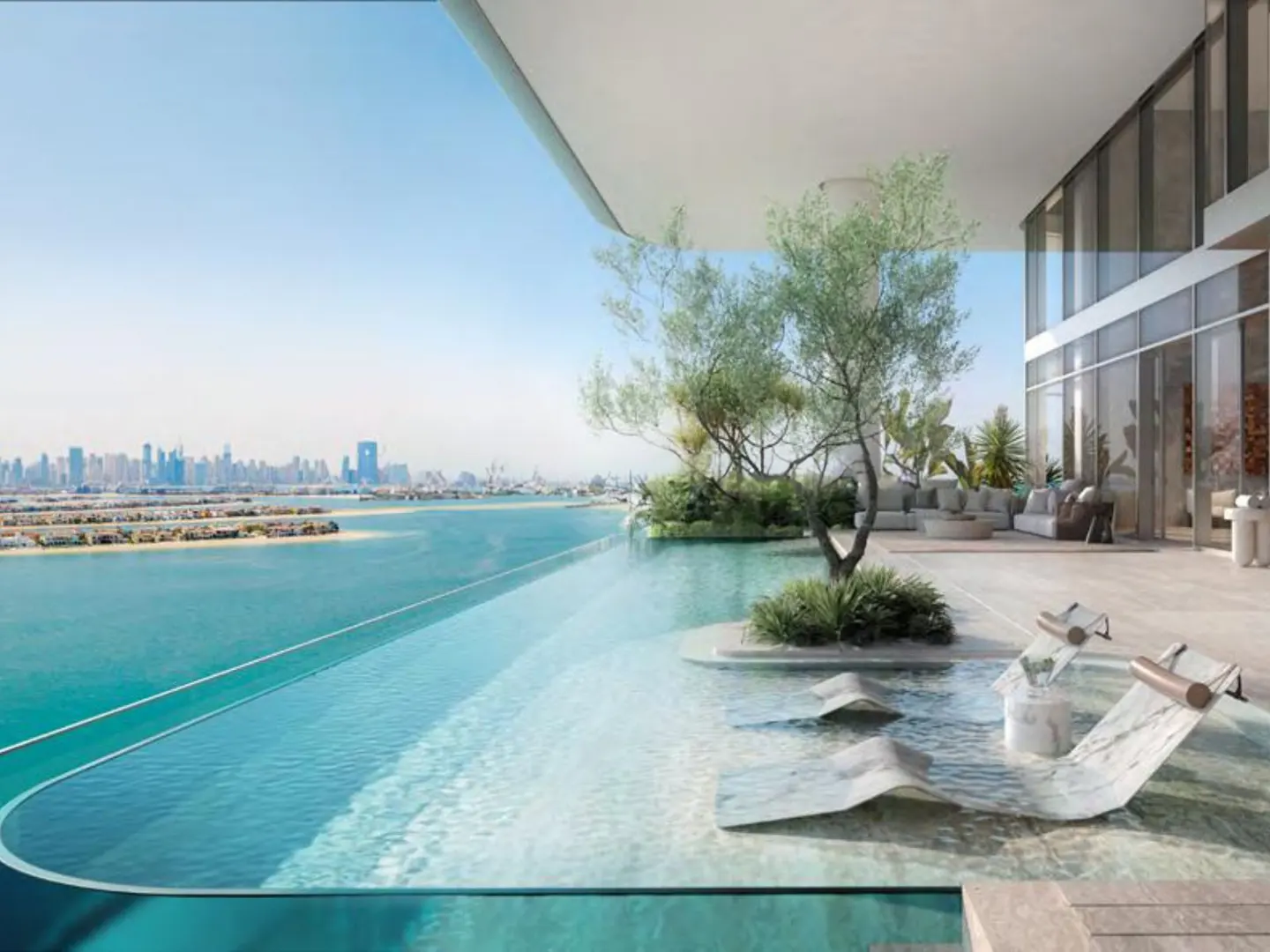 Infinity pool overlooking Dubai skyline. Loungers sit in shallow water, with a tree and seating area nearby.