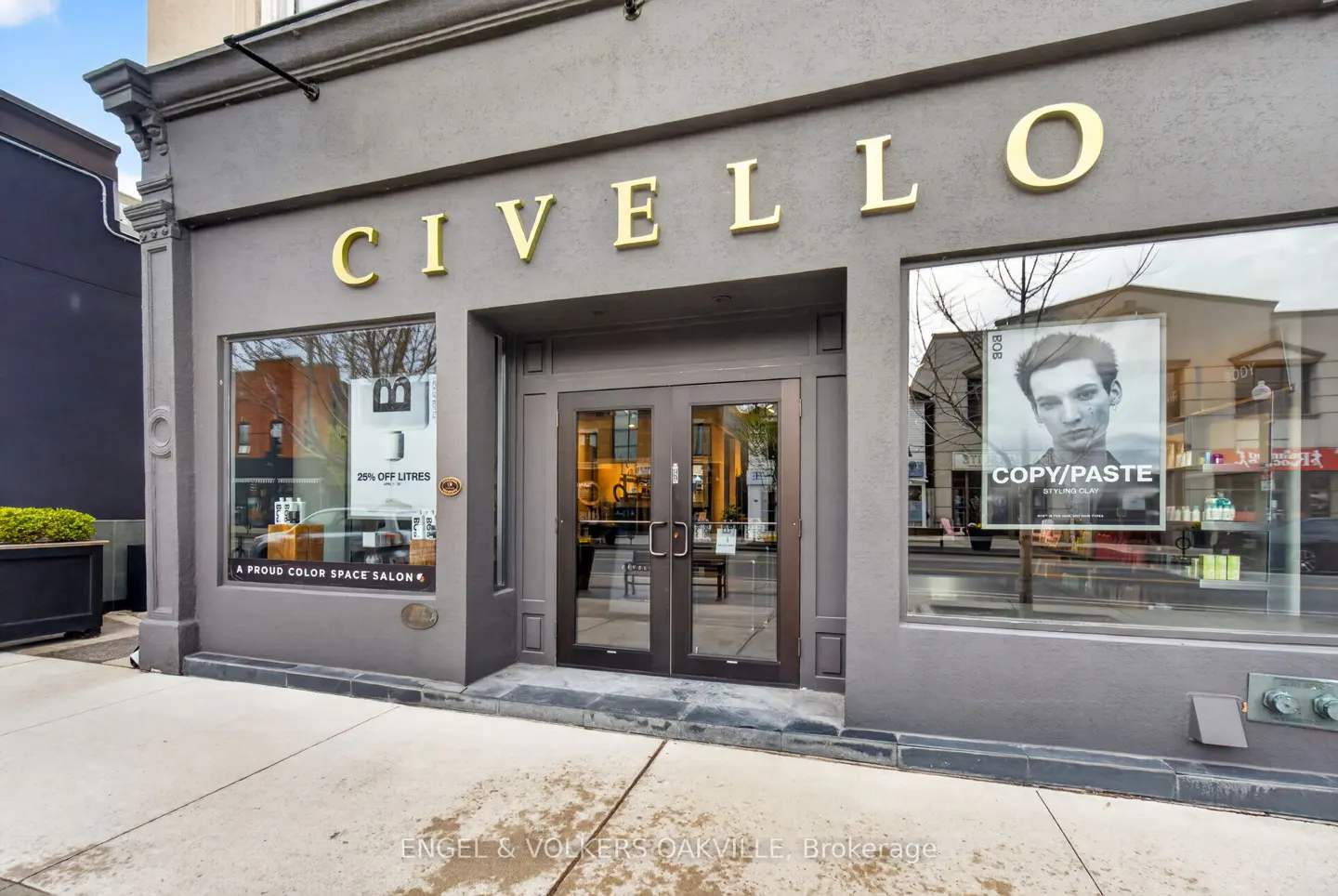 Gray Civello salon storefront with gold lettering above the entrance and window displays.