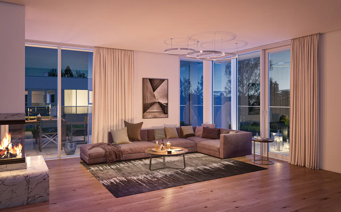 Living room with a brown sectional sofa, a round coffee table, and a marble fireplace. Large windows with curtains overlook a balcony and a garden.