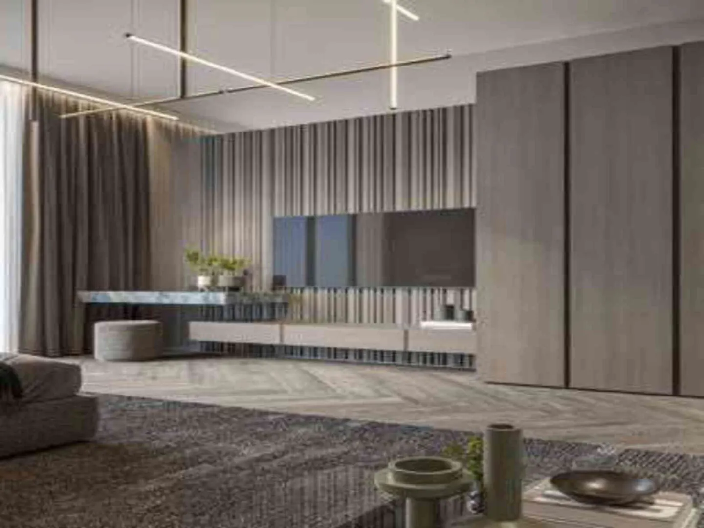 A modern living room with gray tones, featuring a TV, marble table, and linear lighting.