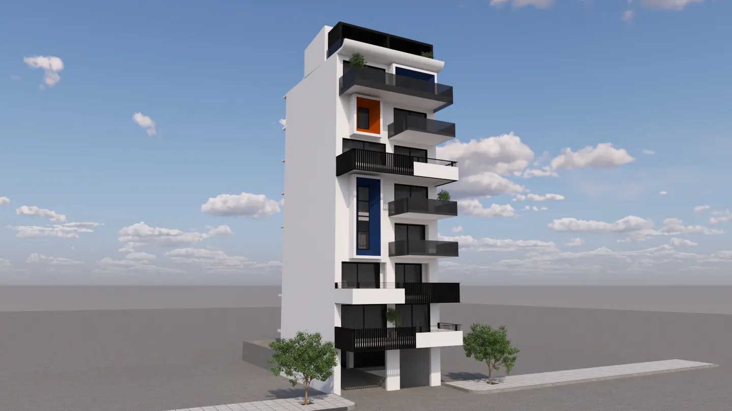 Modern white apartment building with black balconies, blue and orange accents, and a blue sky background.