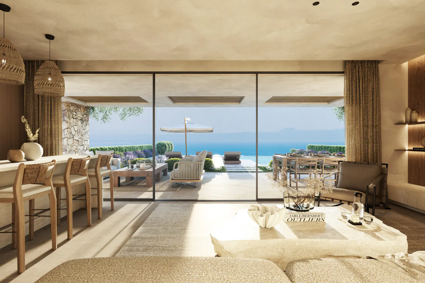 A bright living room with a bar, stone coffee table, and a view of the ocean through large glass doors.
