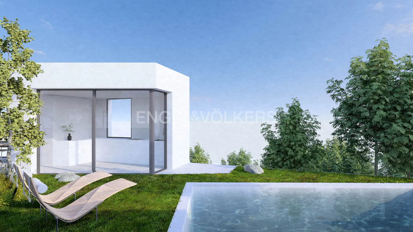Modern white house with a pool, two lounge chairs on the grass, and trees in the background under a blue sky.