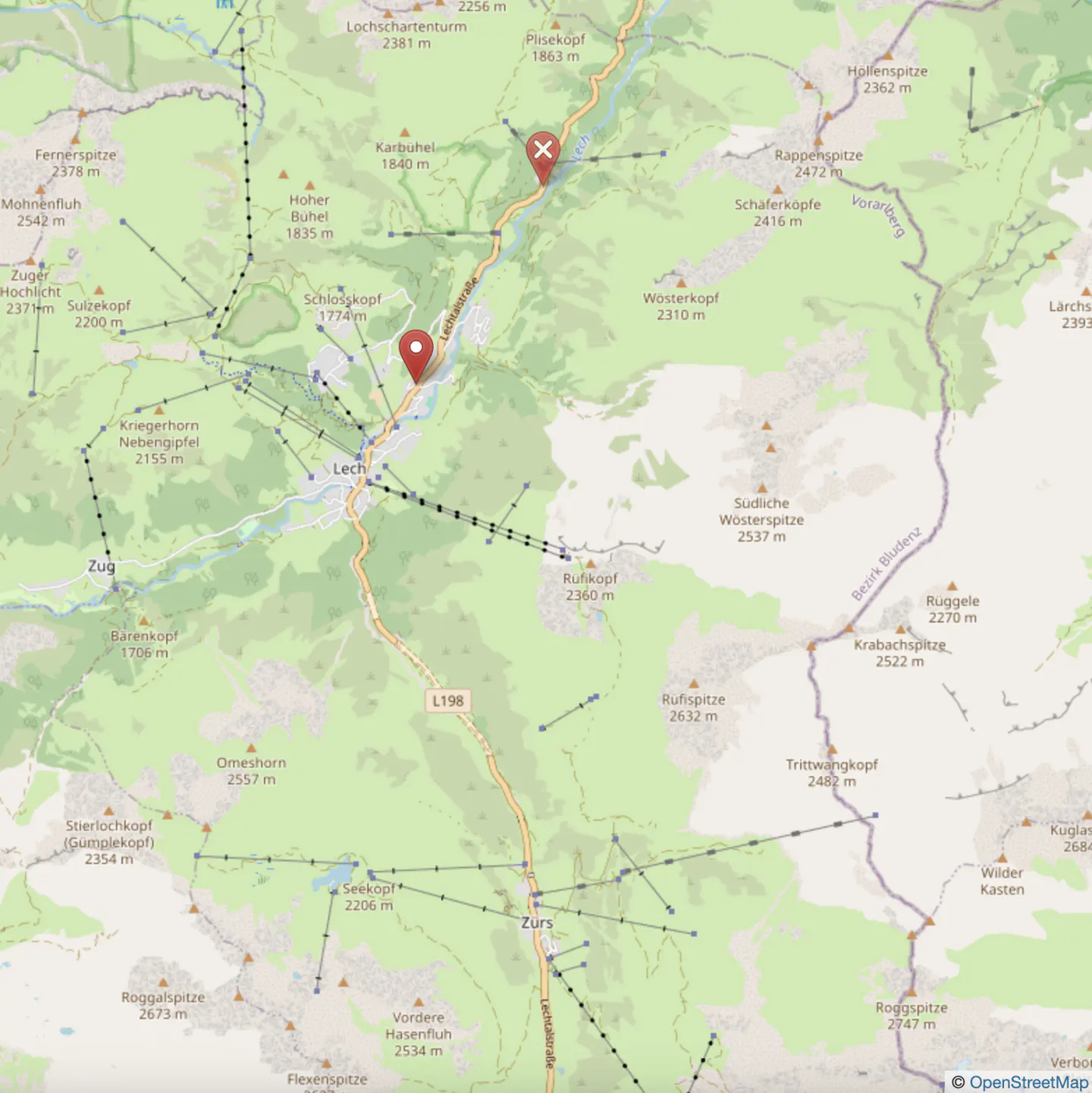Map of Lech and Zürs, Austria, showing ski lifts and mountain peaks. Red pin marks Lech, red X marks a point further north.