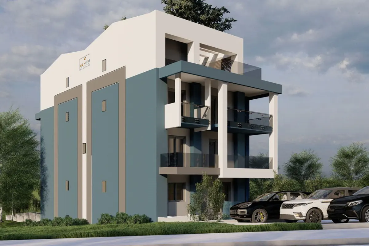 Modern blue and white apartment building with glass balconies and parked cars in front.