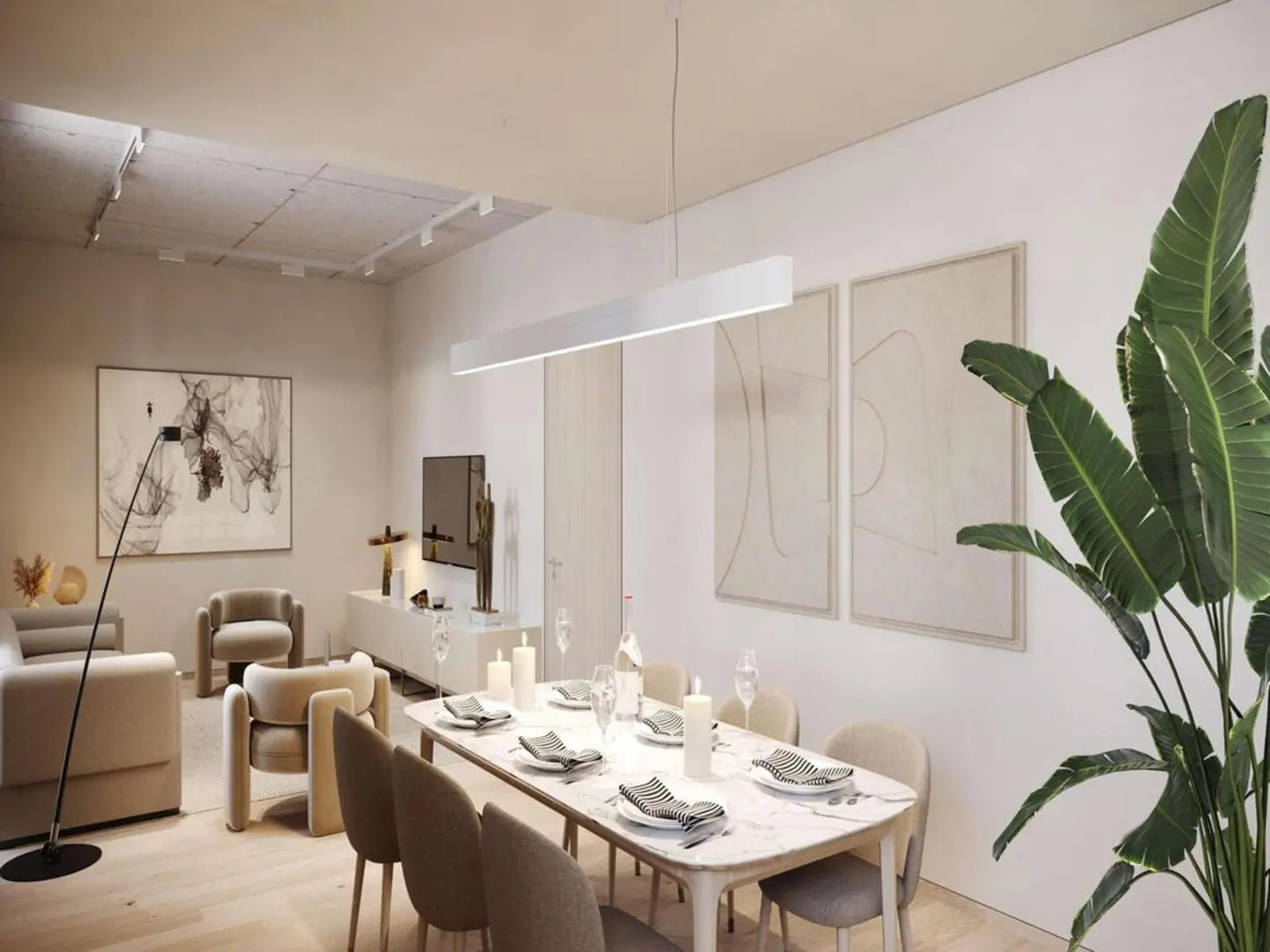 A bright, modern living and dining area with neutral tones. A marble dining table is set for a meal, with abstract art and a large plant nearby.