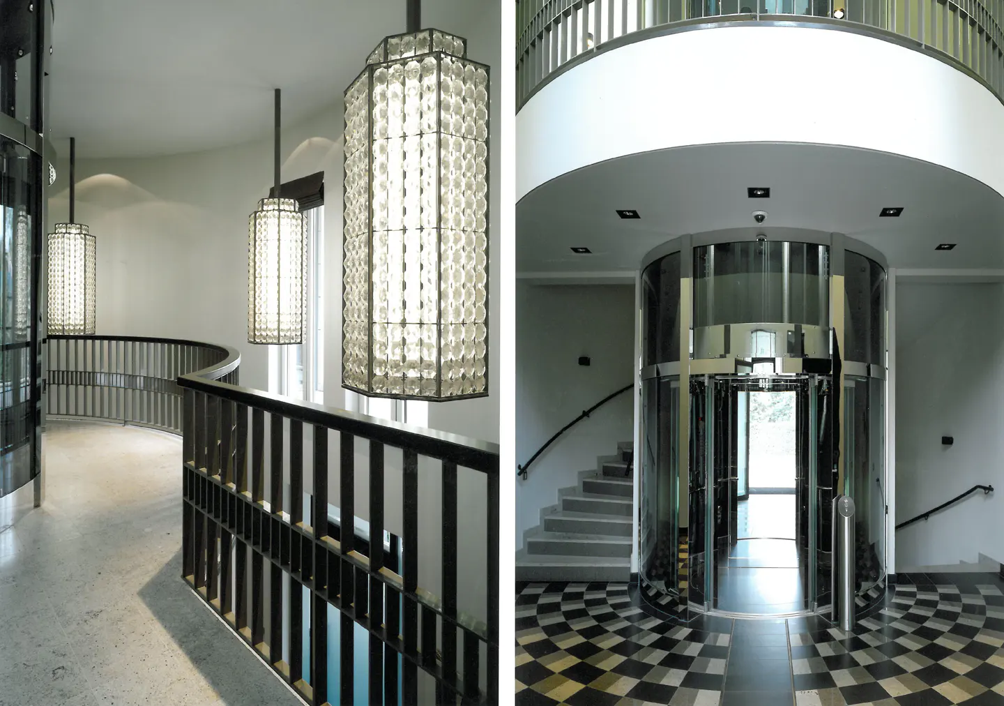 Interior view of a modern building with a glass elevator, staircase, and decorative hanging lights.