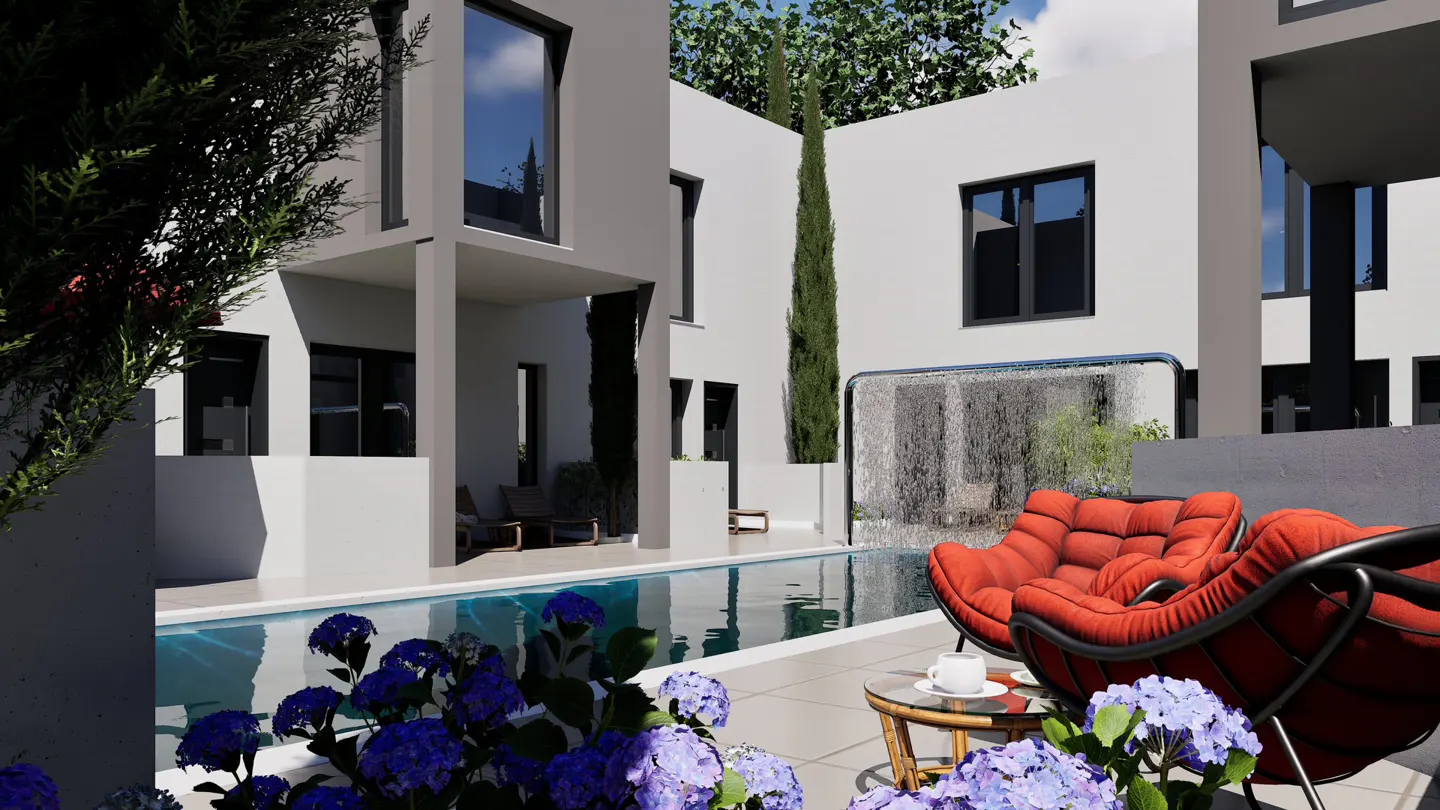 Modern white house with a pool, red chairs, and blue hydrangeas in the foreground. A waterfall feature is visible in the background.